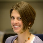 Face of a woman smiling.