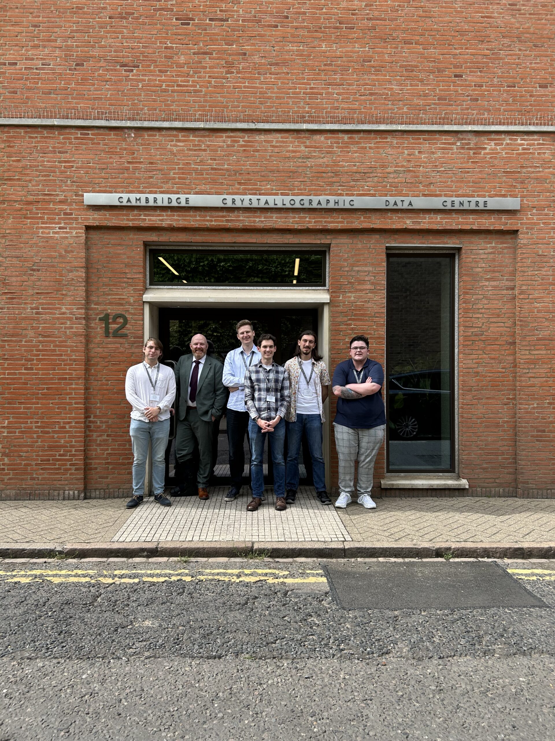 CCDC-sponsored PhD students and supervisor gathered outside the Cambridge Crystallographic Data Centre during the annual Science Day meeting.