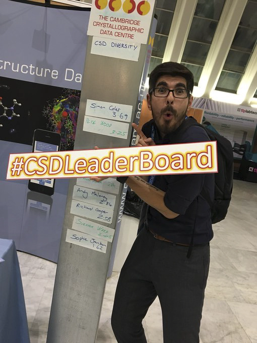 Person pointing at their name on the CSD-Leaderboard.