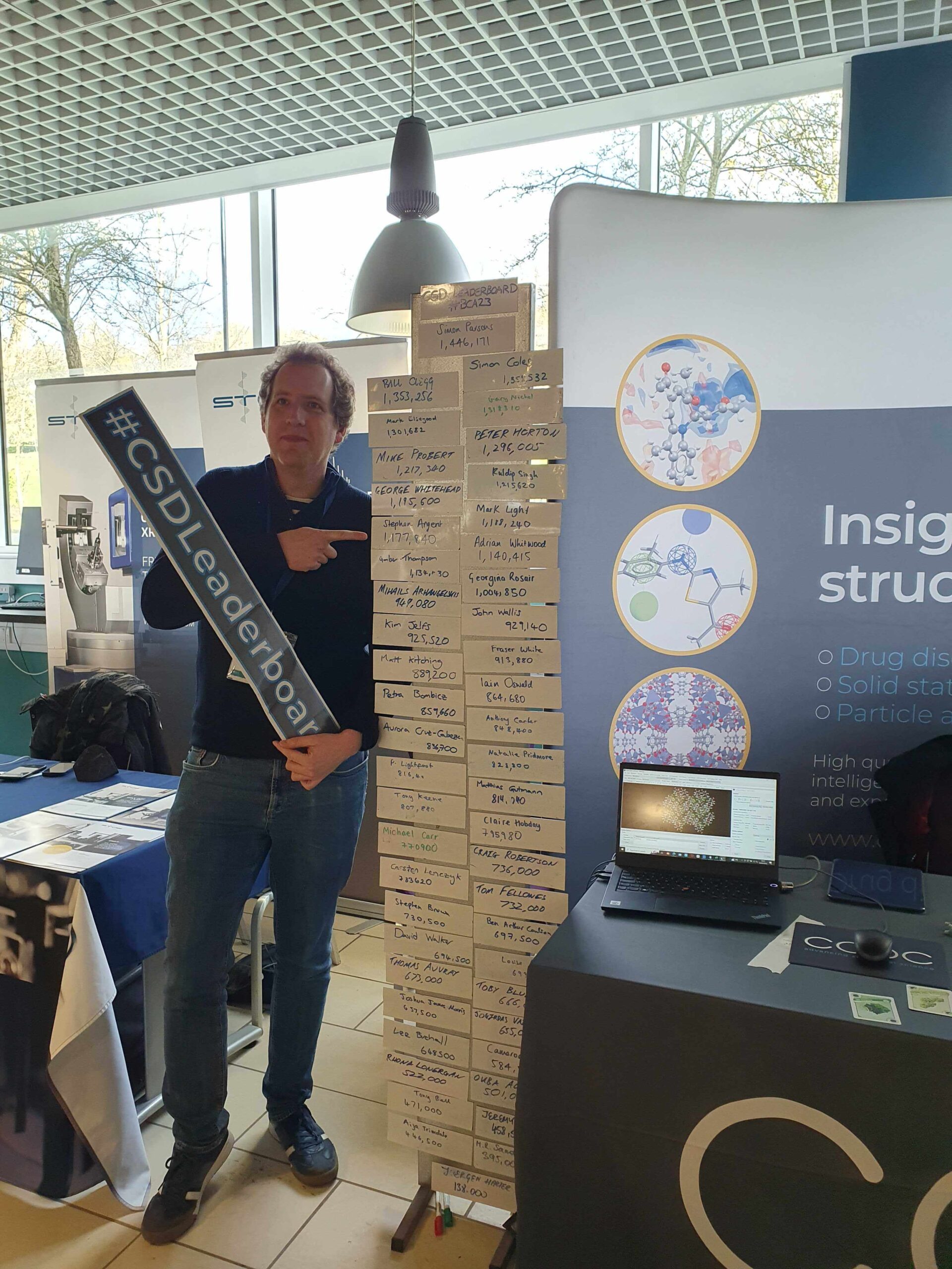 Stephen Argent from the University of Nottingham stood next to the CSD leader board.