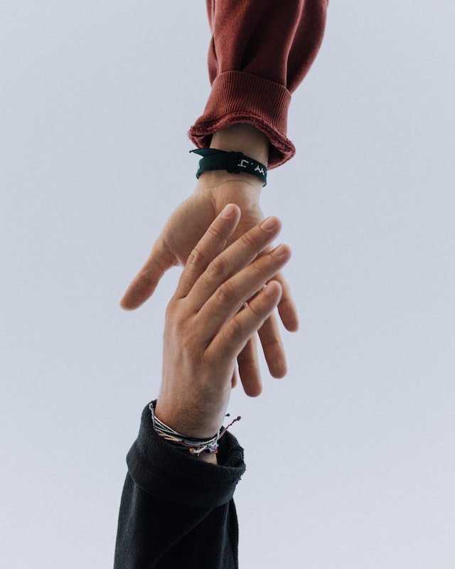 Handshake between two people to represent a partnership.