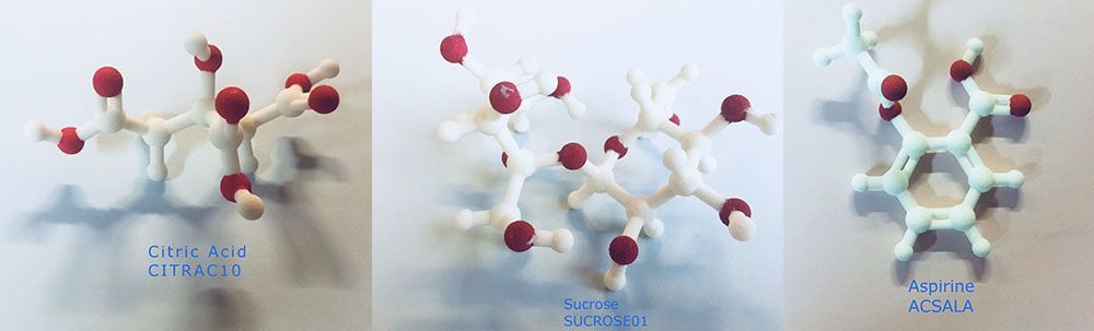Photo of 3D printed models of molecules of citric acid, sucrose and aspirin